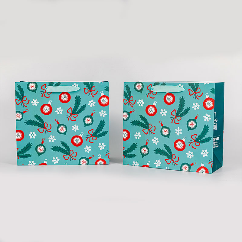 Small christmas gift paper bag with handle